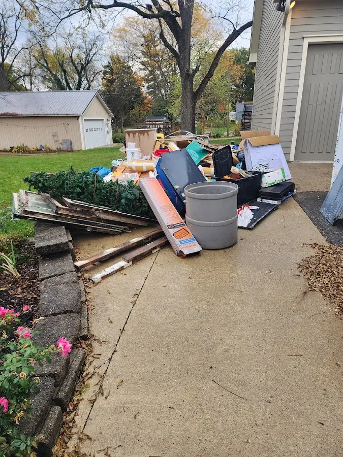 Dumpster being loaded with debris for Commercial Dumpster Rental in Wolfforth